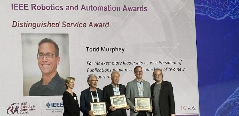 Todd Murphey receiving the IEEE Robotics and Automation Society Distinguished Service Award at ICRA 2025 in Atlanta, Georgia.